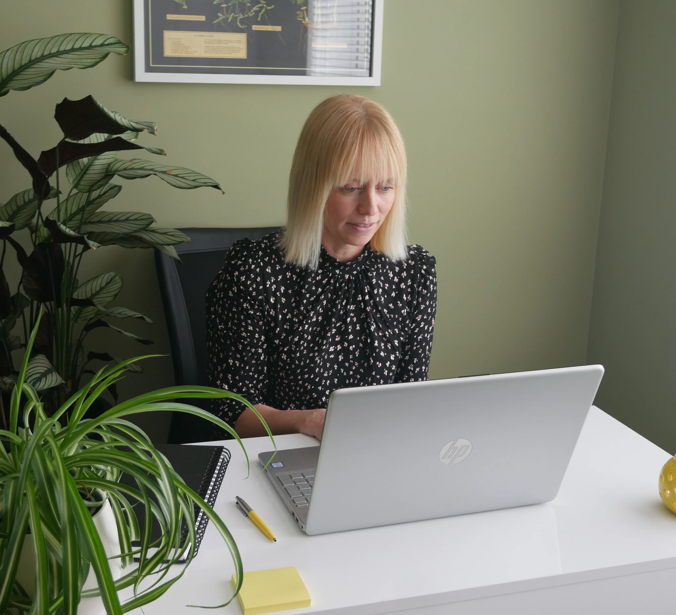 Emma working at her laptop